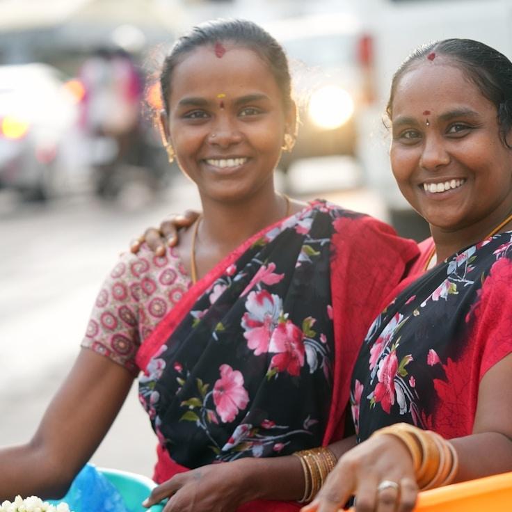 Aisha Noor, Lead Design Curator at Securein Vestment Forum, reviewing corporate floral arrangements